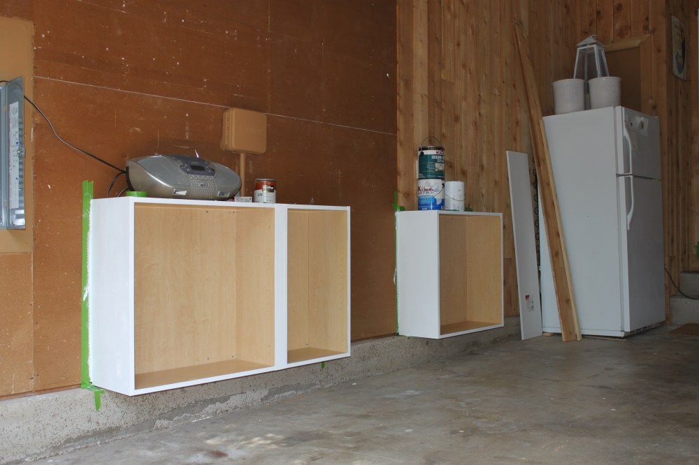 Cabinets Hung and Wood Walls Begun