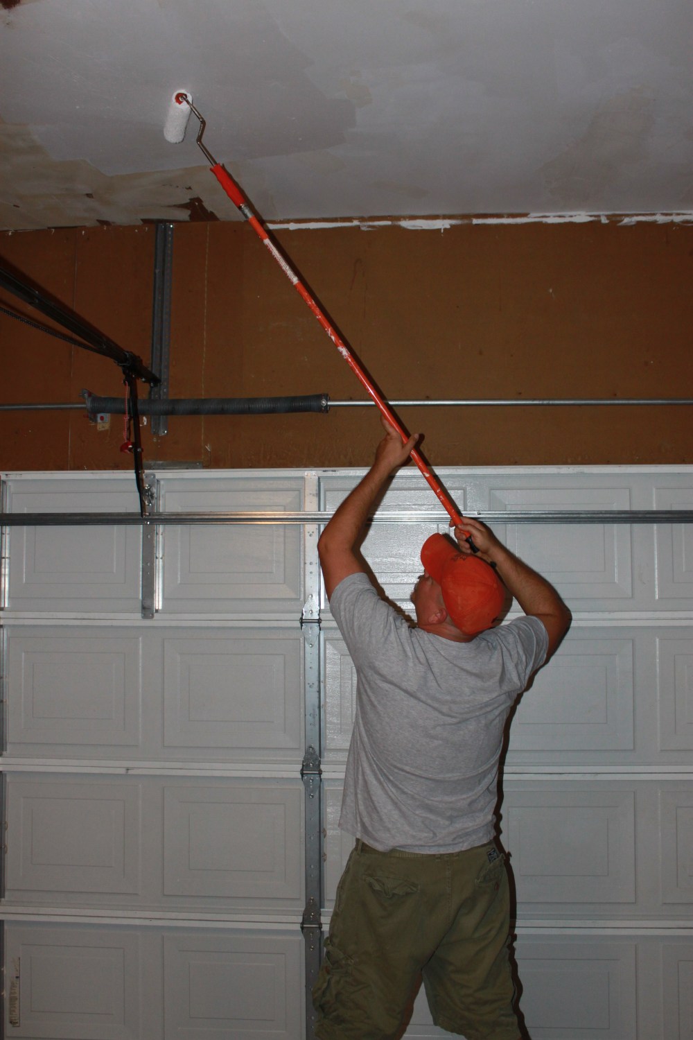 James Rolling the Garage Ceiling
