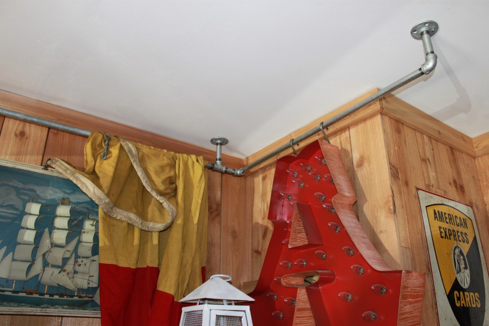 Big A hanging from pipes