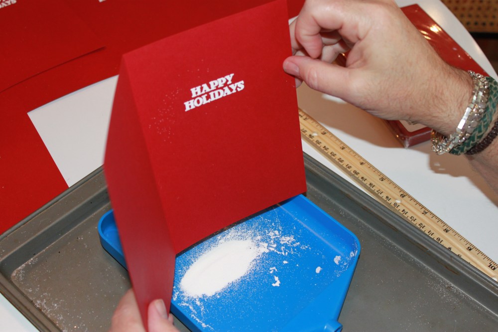 Tapping the Escess Powder off into the No Spill Tray Mate