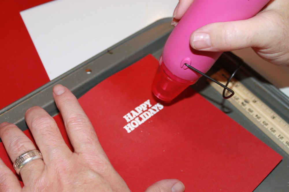 Using the Heat Gun to set the Embossing Powder