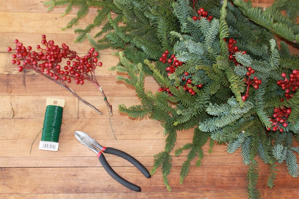 Wire Plastic Berries into the wreath
