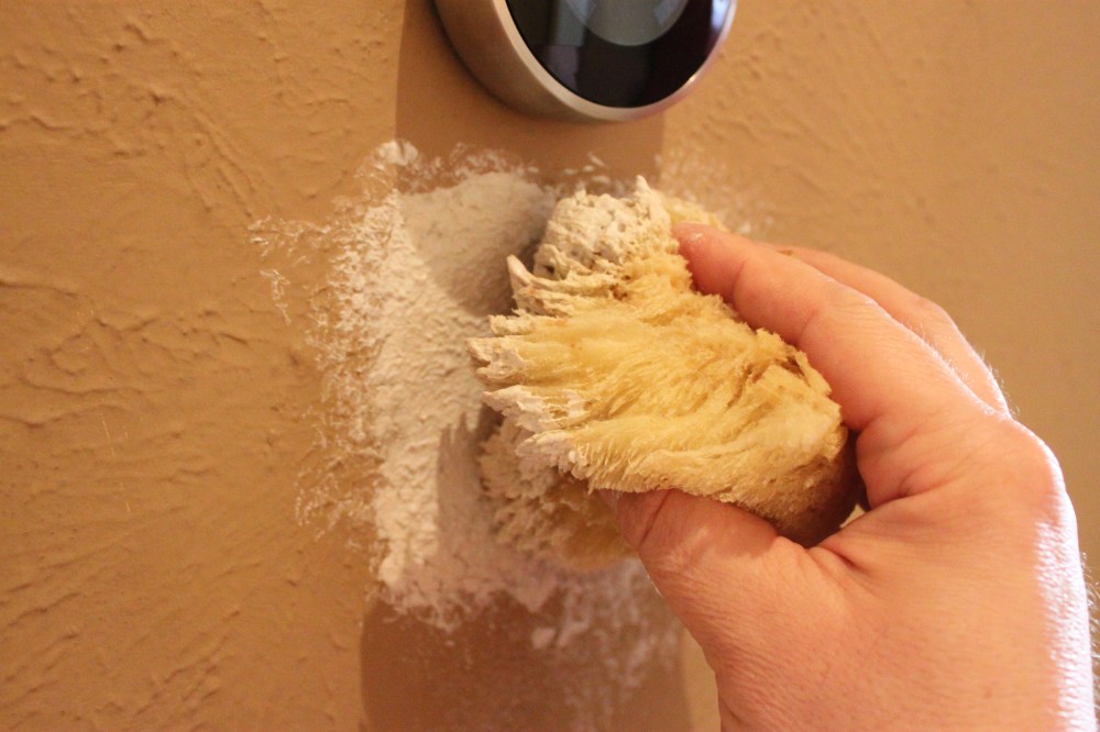 Dabbing Joint Compound on the Wall