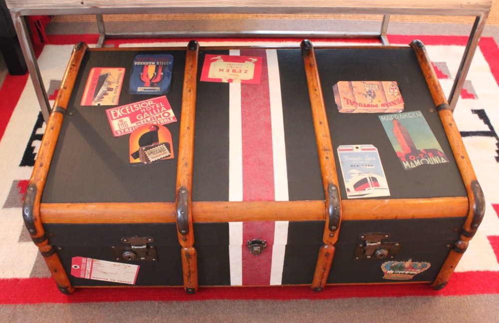 Black Painted trunk with Plenty of Travel Stickers