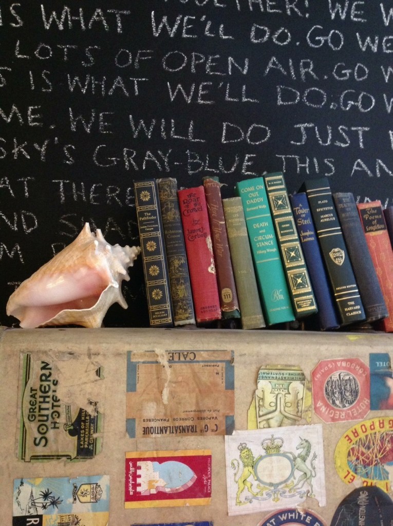 Vintage Books on a Velum Suitcasewith Plenty of Stickers