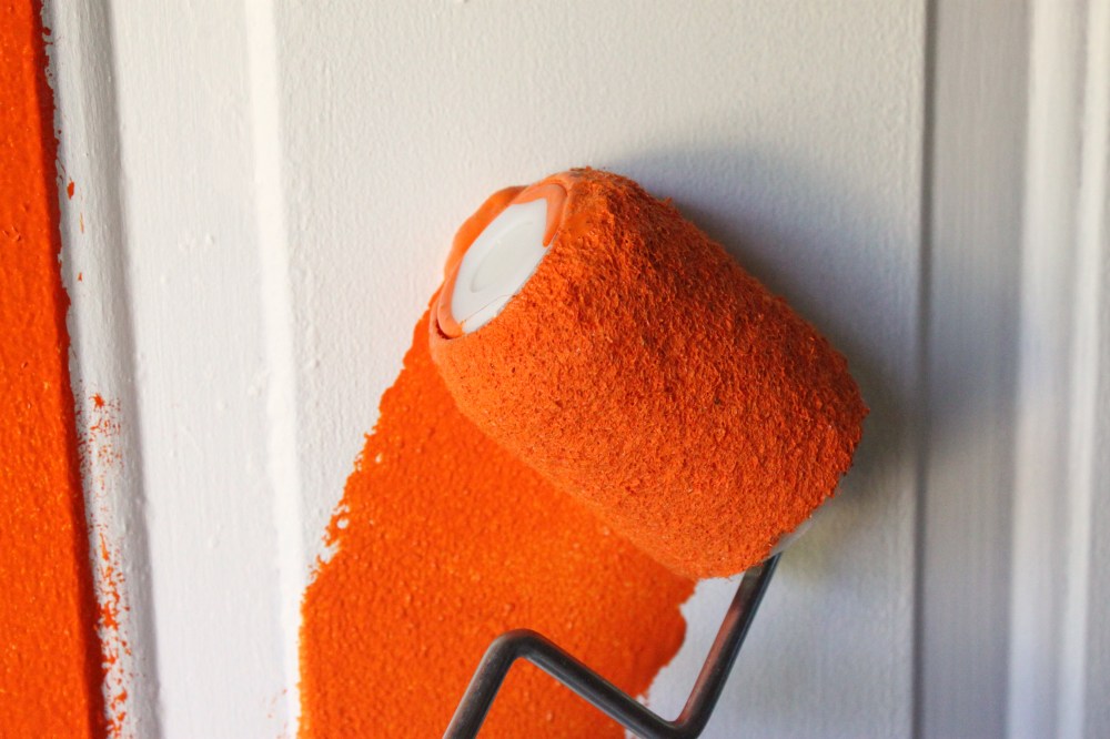 Rolling on the Orange Paint