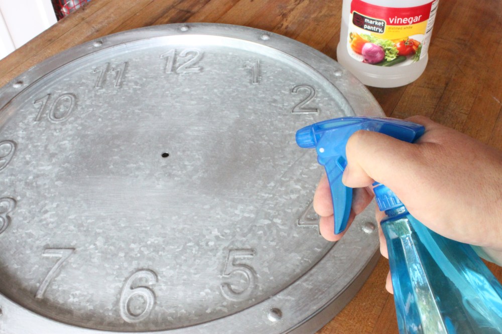 Spritzing the Clock with White Vinegar