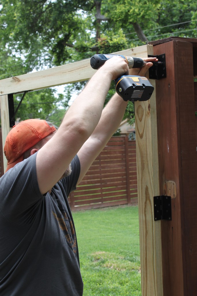 James Screwing on the Hinges for the New Gate