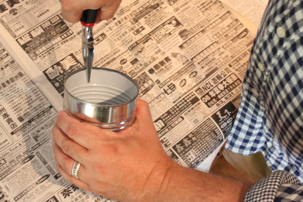 Use a Pair Of Needle Nose Plyers to Make a Spout in the Can