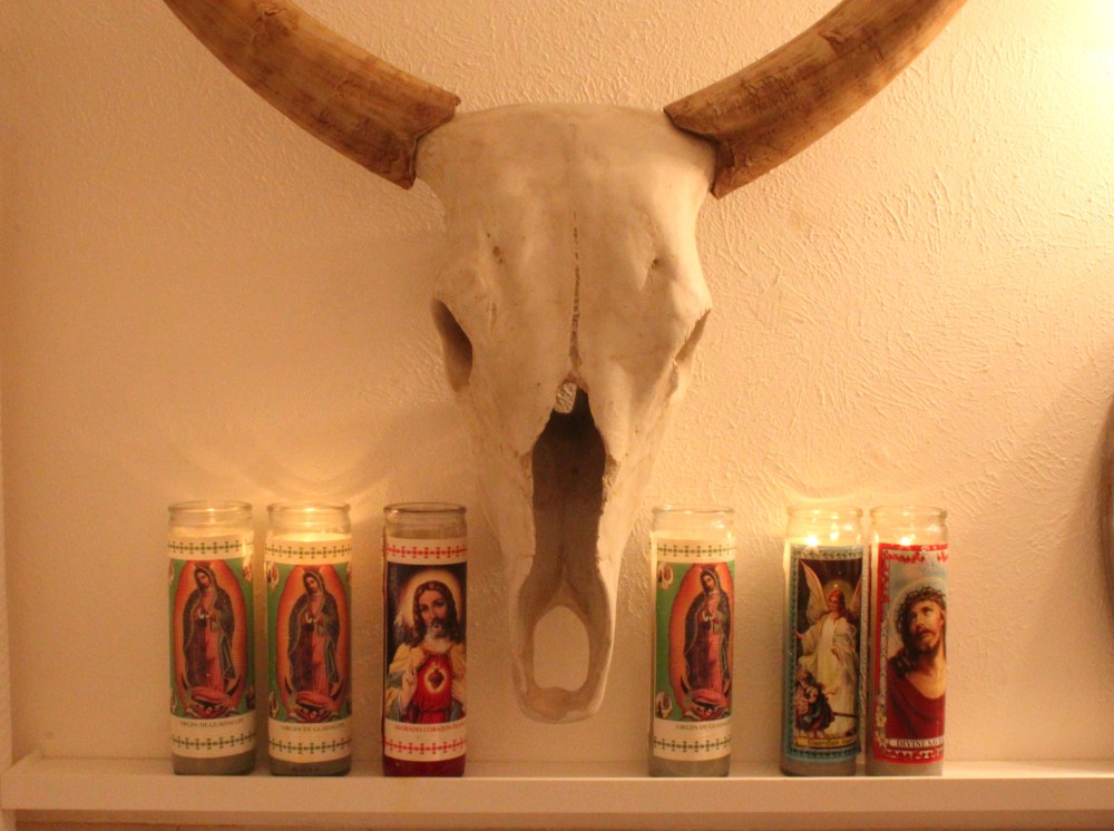 Santos Candles with Cow Skull in the Bathroom