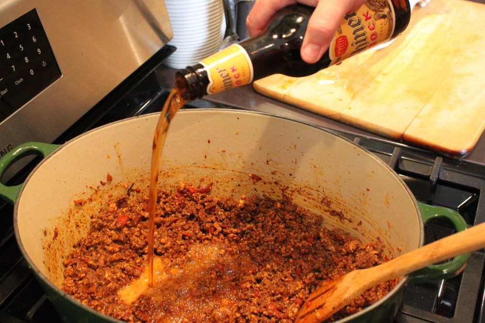 Add the Beer to the Browned Meat Mixture