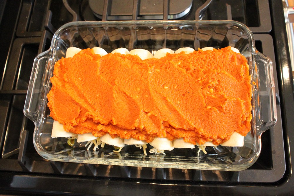 Pumpkin Enchiladas with Sauce Spread on Top