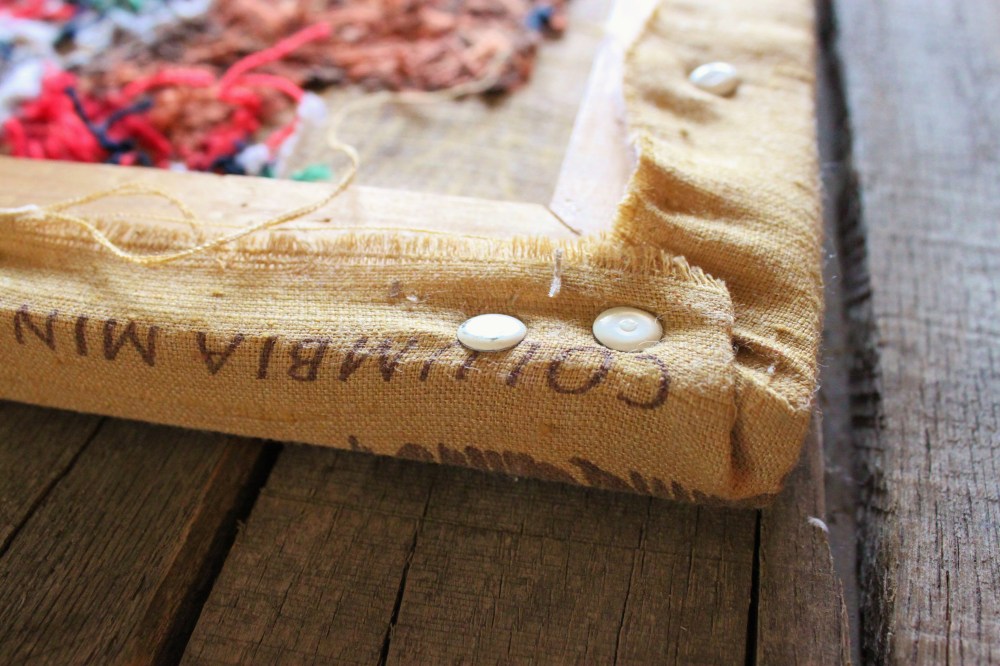 Thumb Tacks Holding Together the Crewel Work Indian Chief