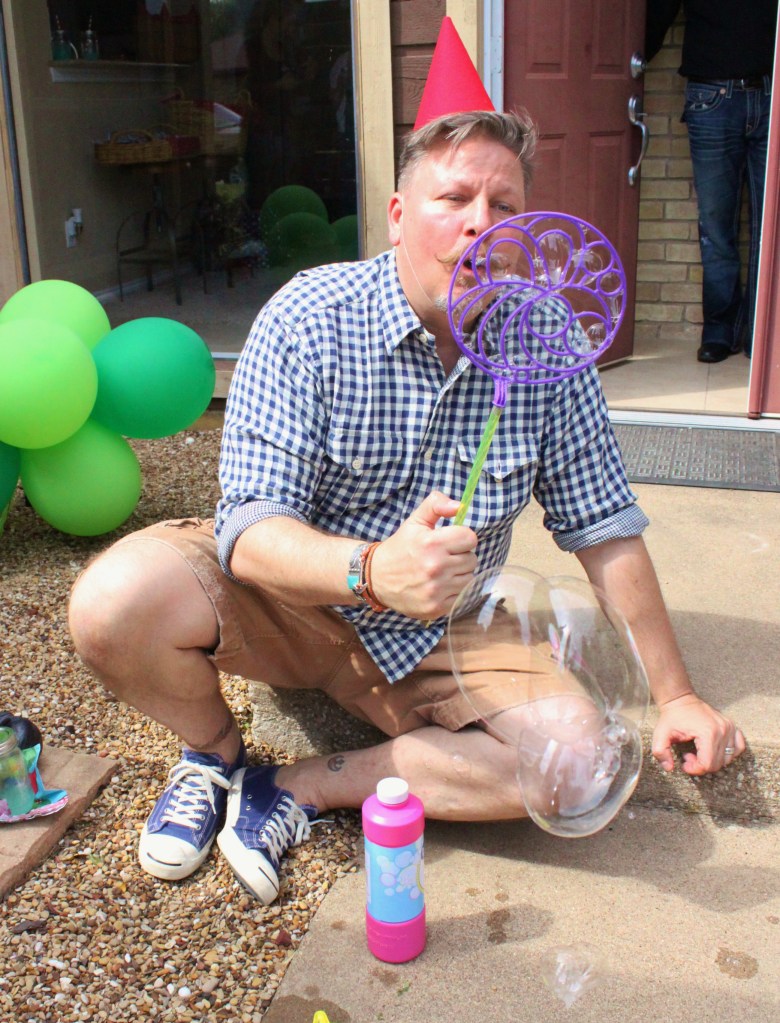 James Blowing Bubbles at the Birthday Party