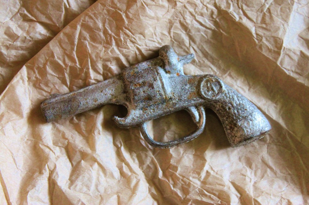 Cast Iron Gun-Shaped Bottle Opener in Question
