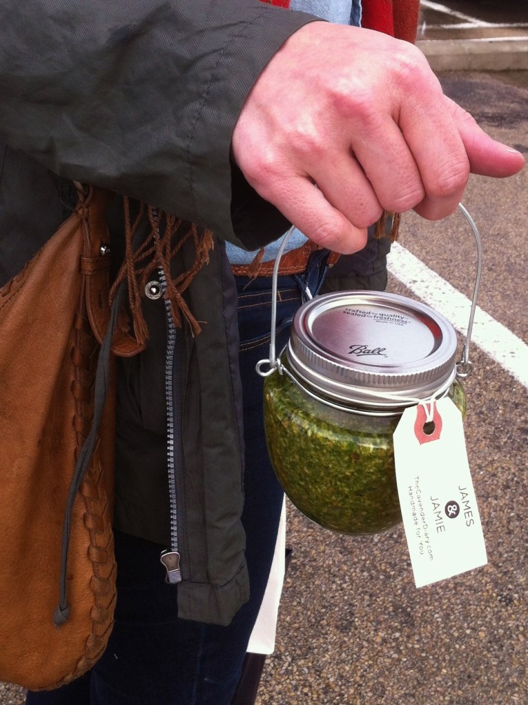 Ashley with a Jar of Cavender Diary Pesto