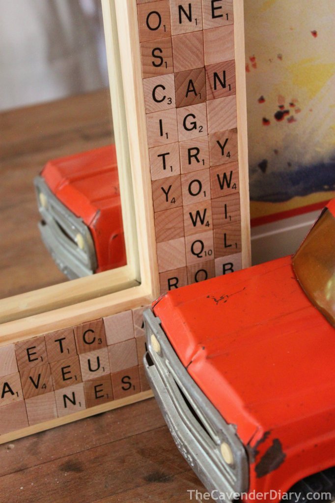 Close Up of Scrabble Tile Mirror with Orange Tonka Truck