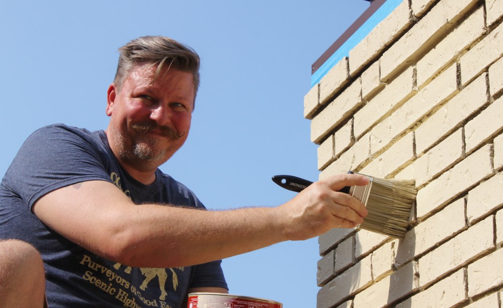 James and his Sweet, Sweet Stache Painting the Chimney