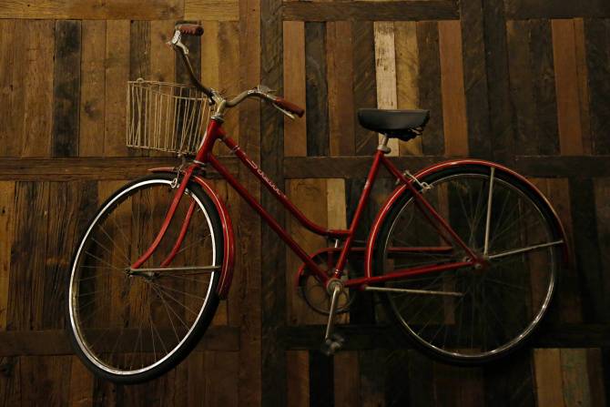 Red Bike on the Wall of the Rustic