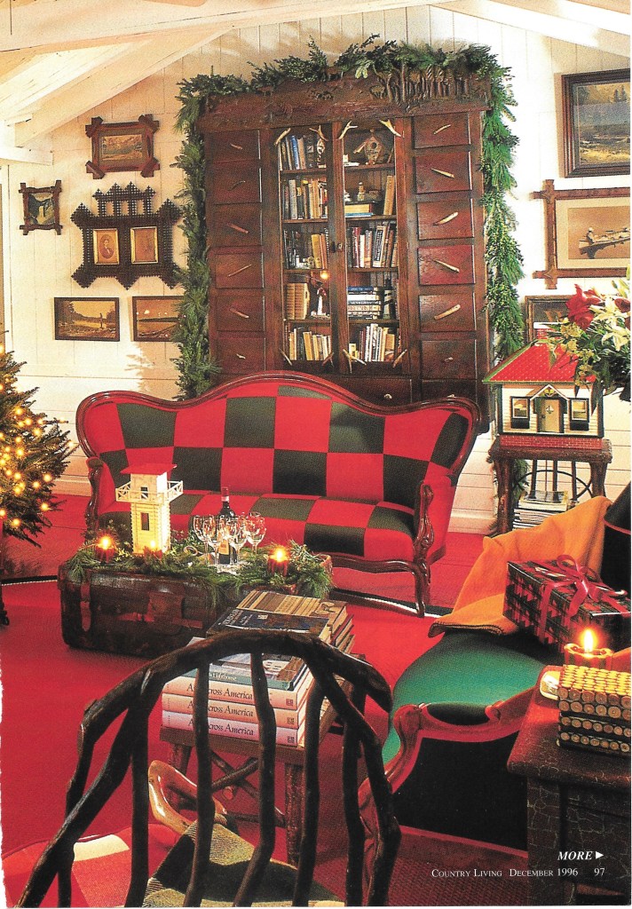 Red and Green Checkered Sofa in Front of Tramp Art Cabinet