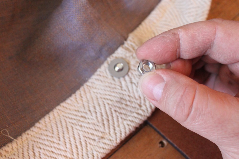 Us ea Nut to Hold the Screw in Place on the Inside of the BAg