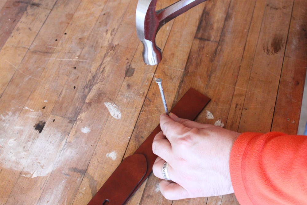 Use a Nail to Poke Holes in the Leather Belt