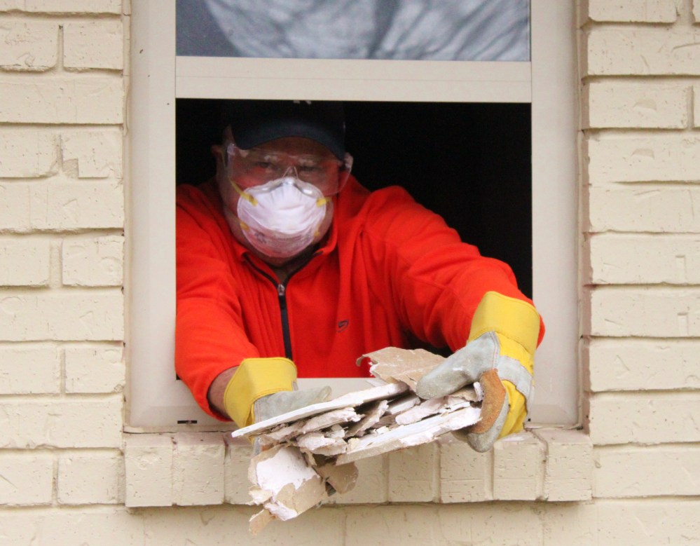 Jamie Moving Debris from the Bathroom Window