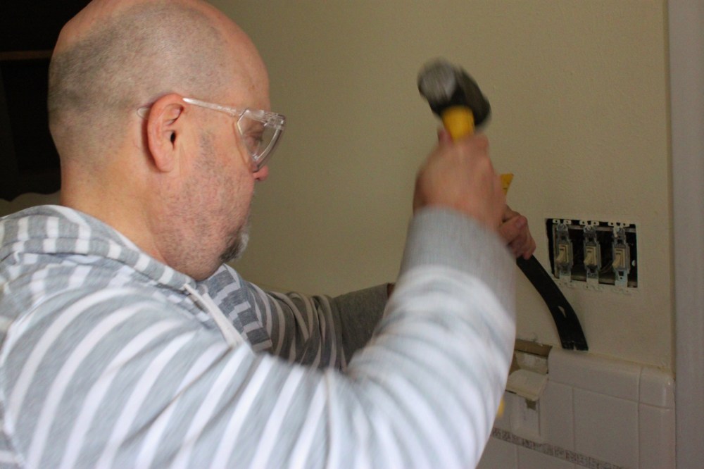 Jamie Uses the Crowbar to Start the Tile Removal