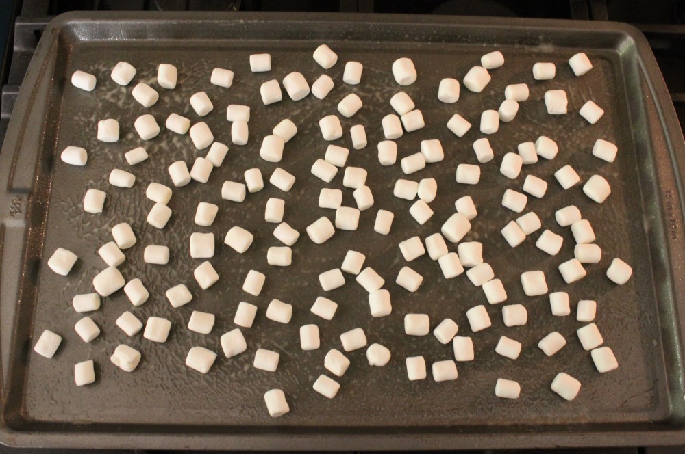 Spread the Mini Marshamallows Evenly on the Sprayed Cookie Sheet
