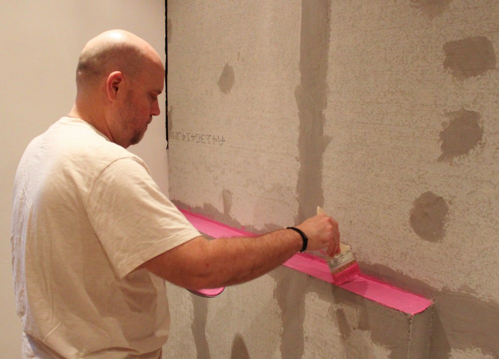 Jamie Painting on the Pink Water-Proofer