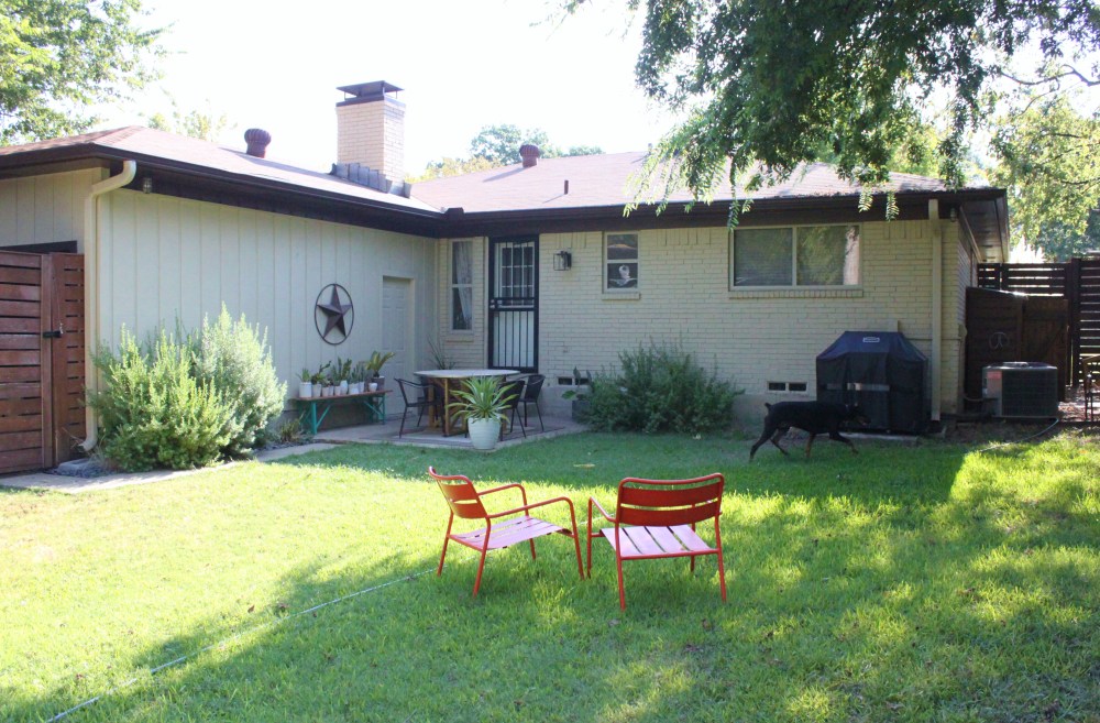 Back of the Cavender House with Running Doberman