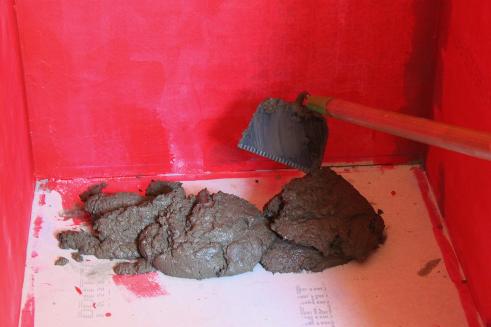 Starting in the Back of the Shower with the Cement Mix