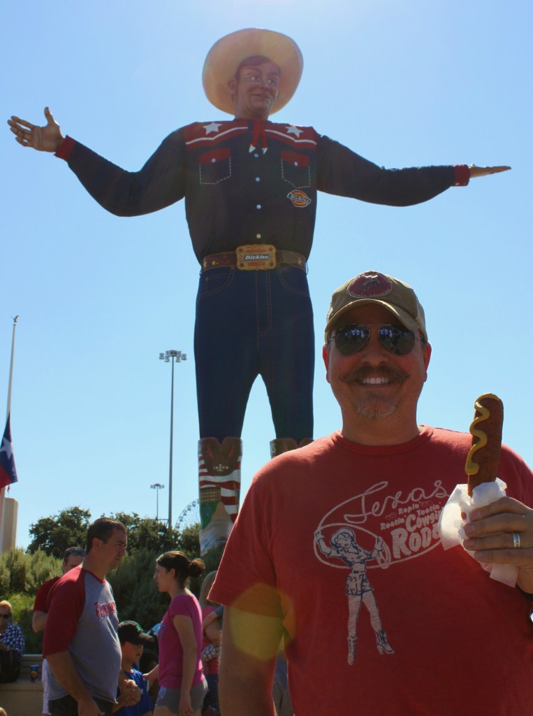 James and His Corny Dog in Front of Big Tex