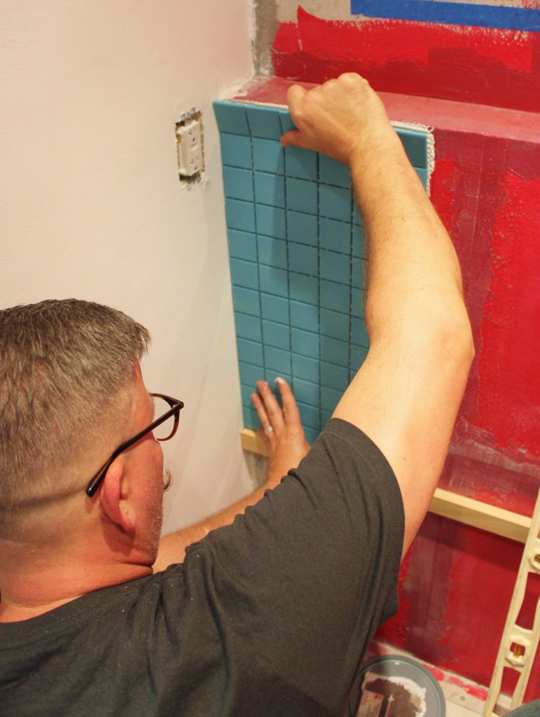 James Installing the Very First Piece of Tile in the Master Bathroom