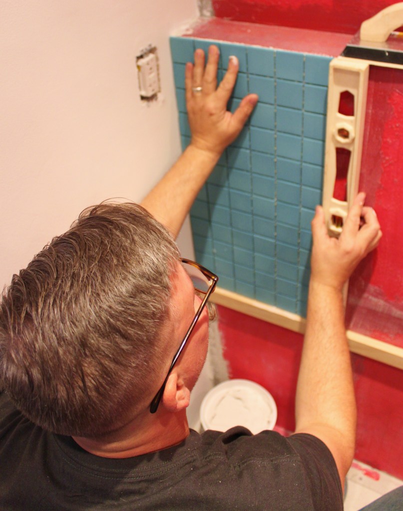 James Making Sure that Frist Piece of Tile is Level