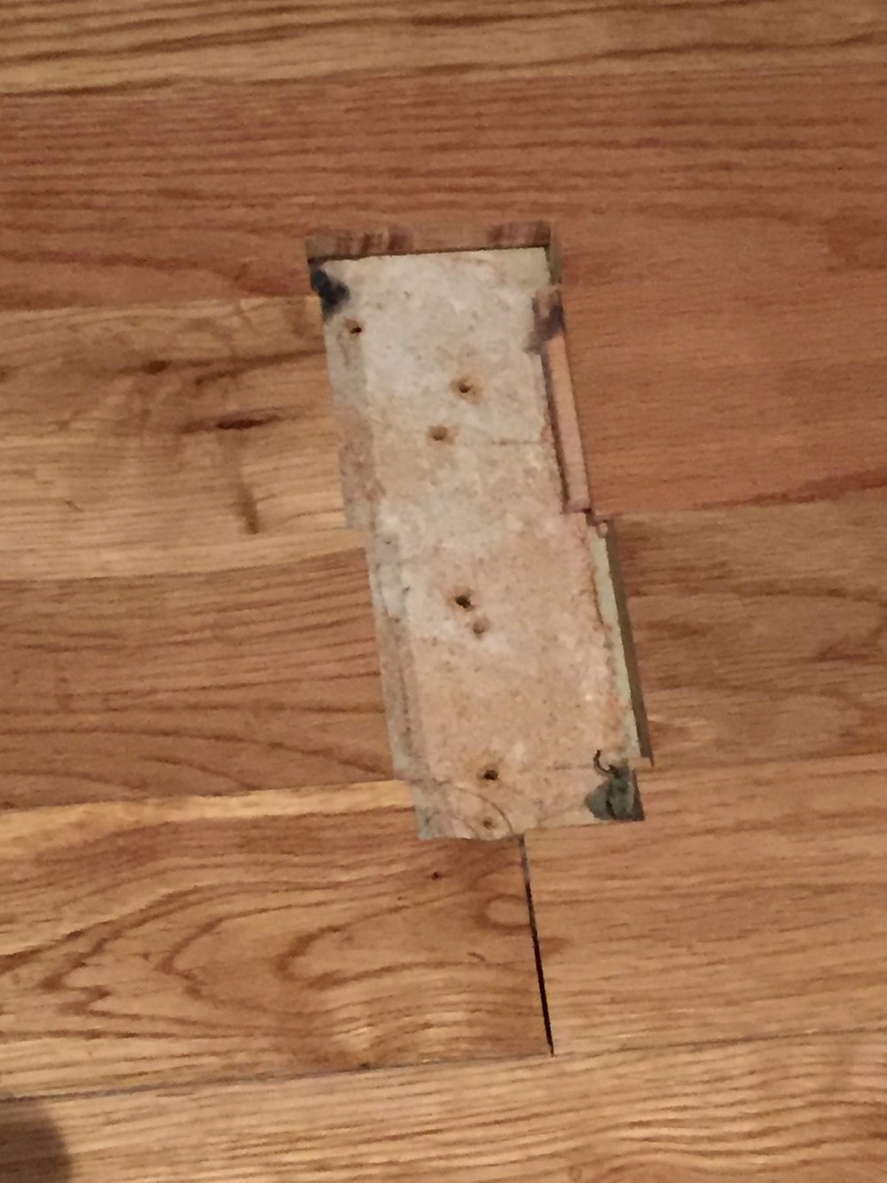 Actual Hole in the Wood Floor Where the Door Slide Was