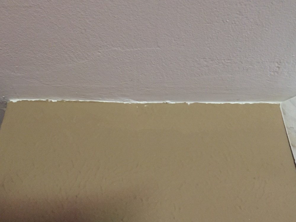 Close Up Of Wall Over Coats