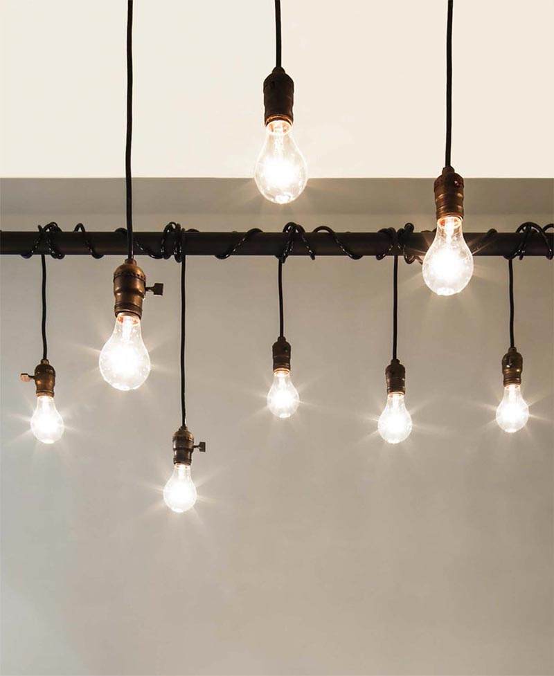 Edison Bulbs Hanging from Plumbing Pipe