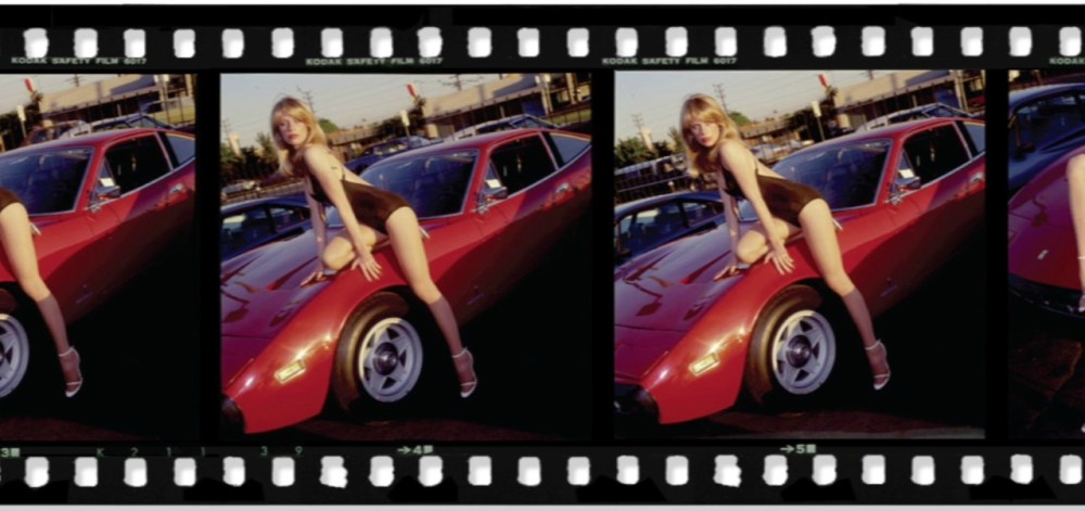 Candy Posing on the Ferrari